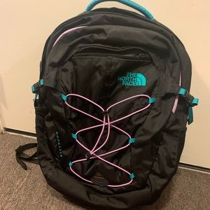 Black ,teal and purple north face backpack